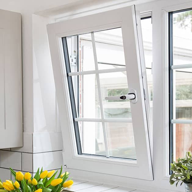 Everest tilt and turn upvc window tilted open in white with flowers
